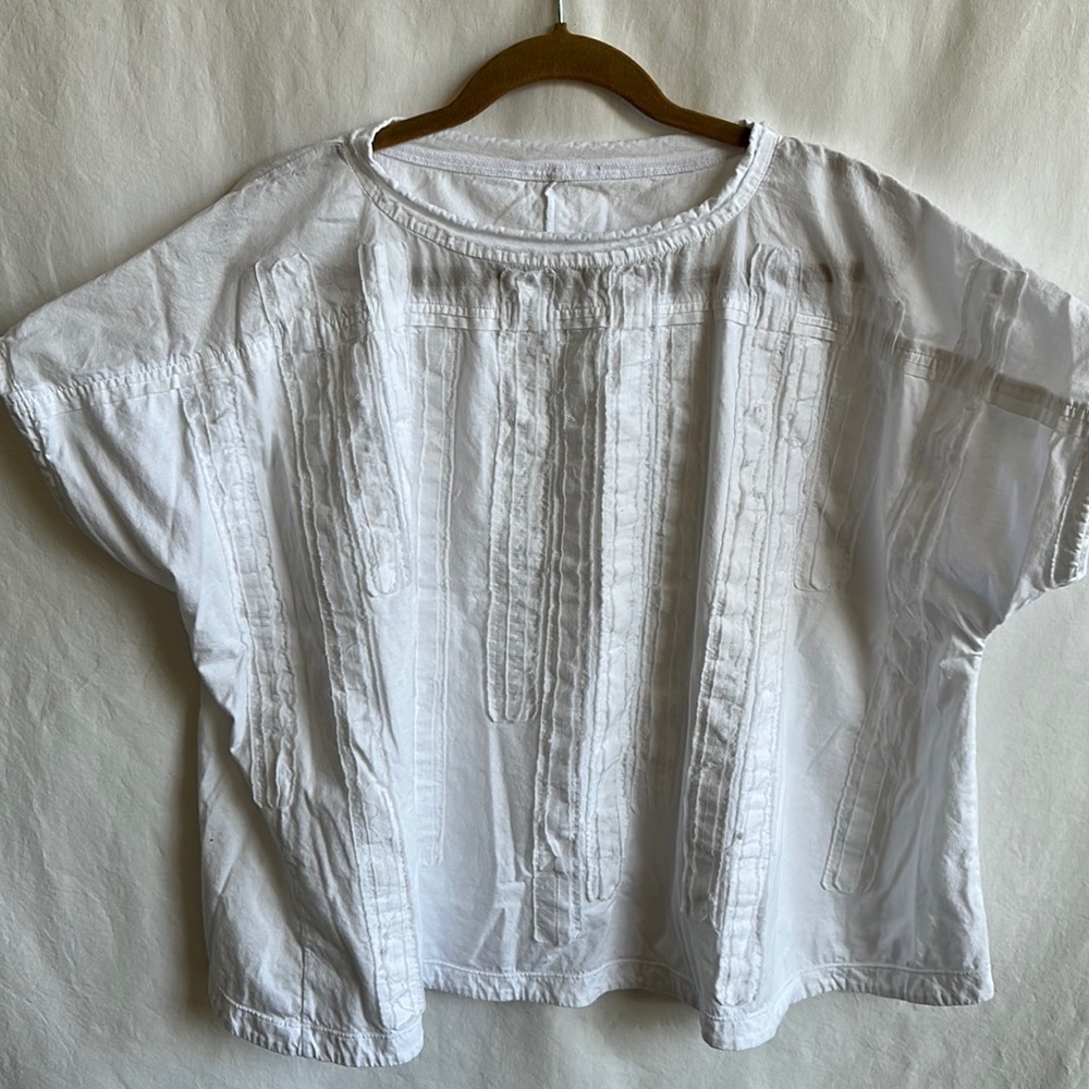White swing top with raw seam design